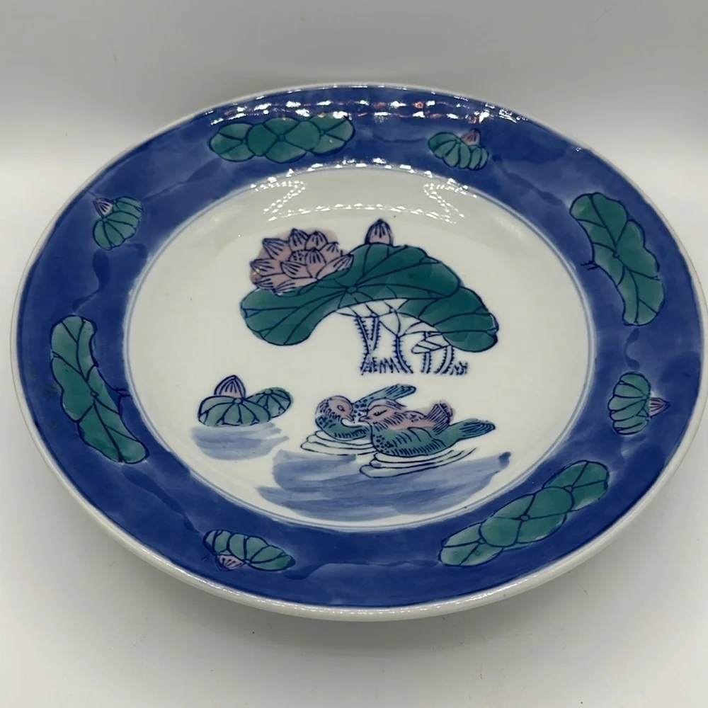 Chinese blue, white, and teal serving bowl with birds and lily pads